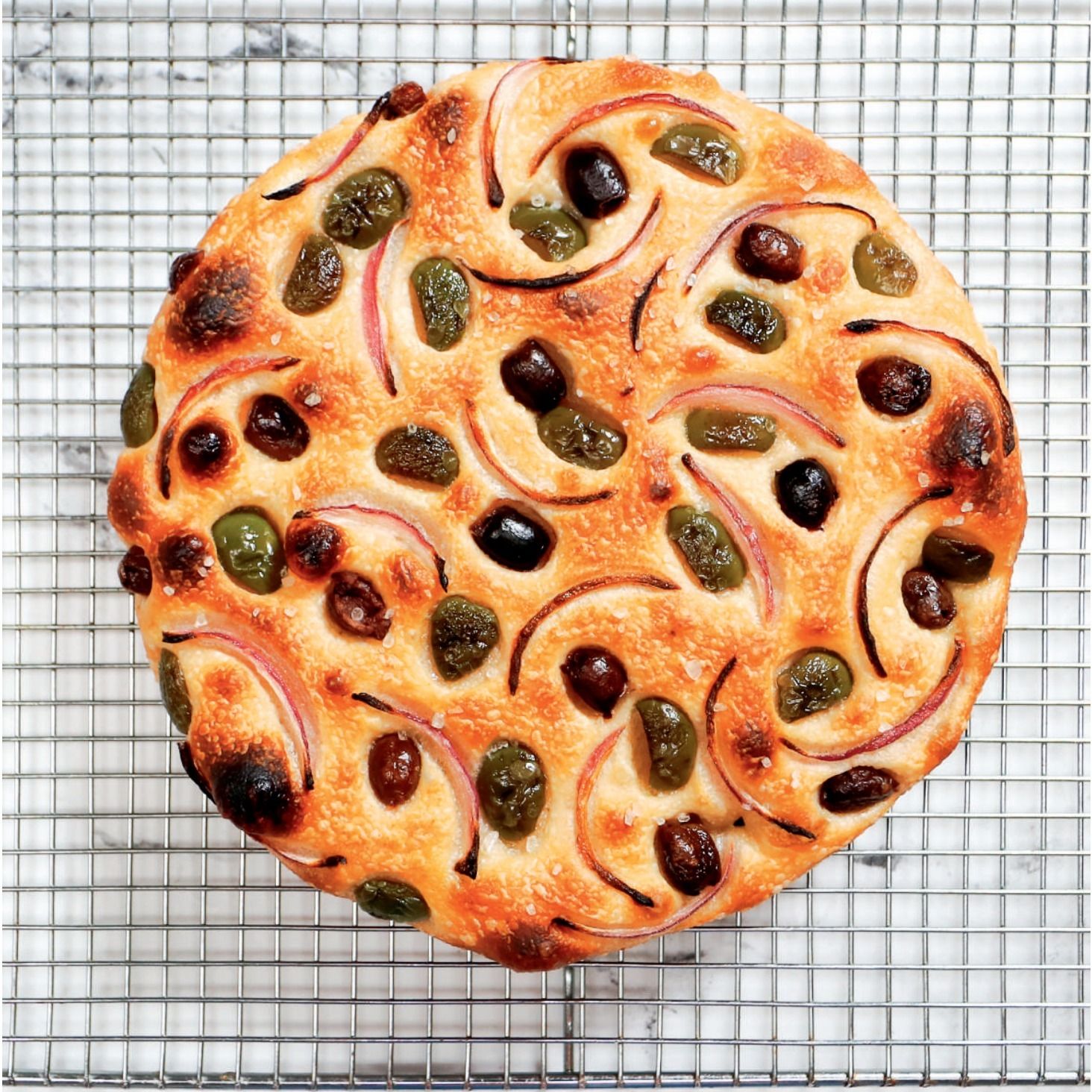 ⁣Play Me a Recipe: Anthony Falco makes Onion & Olive Bread